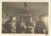 <h5>Combat</h5><p>Officers in the kitchen of a farmhouse. Captain Elmore Willets (middle right). Photo provided by the family of Elmore Willets. </p>