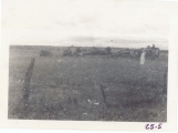 <h5>Combat</h5><p>Placing a gun. Note the Allis Chalmers tractor. Photo provided by the family of Elmore Willets.</p>