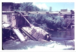 <h5>Tiger Tank</h5><p>Tiger tank in the canal at Kolbermoor, Germany. Likely taken after the War. Photo provided by the family of Kenneth James Taylor.</p>