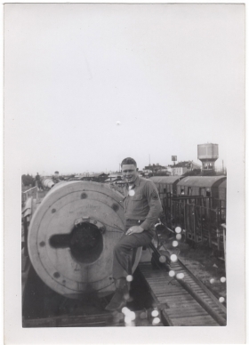 <h5>German Cannon</h5><p>Clint Stillman standing on the loading end of the massive German train cannon. Provided by the family of Ivo Schommer.</p>