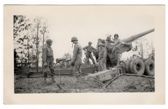 <h5>Loading Shell</h5><p>Soldiers loading a shell. Likely during training. Photo provided by family of Ivo Schommer.</p>