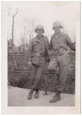 <h5>Soldiers</h5><p>Unidentified soldiers on bridge. Photo provided by family of Ivo Schommer.</p>