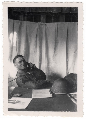 <h5>Clinton Stillman</h5><p>Clinton Stillman at desk. Photo provided by family of Ivo Schommer.</p>